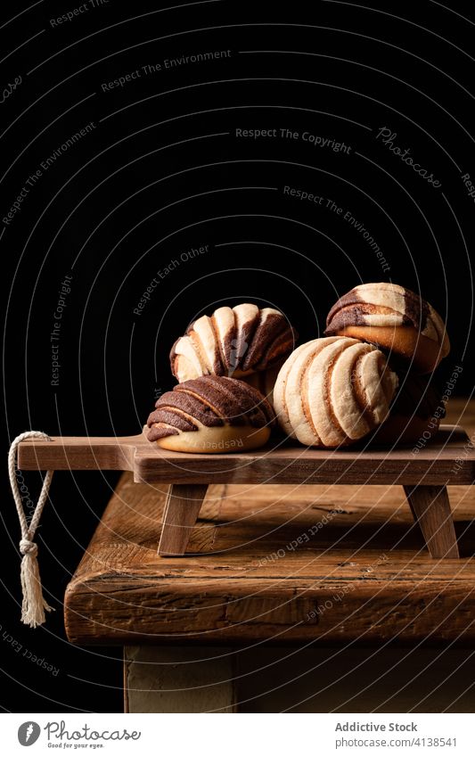 Sweet Mexican conchas on cutting board bread bun baked sweet dessert delicious wooden culture tradition mexican food roll tasty fresh meal chopping board