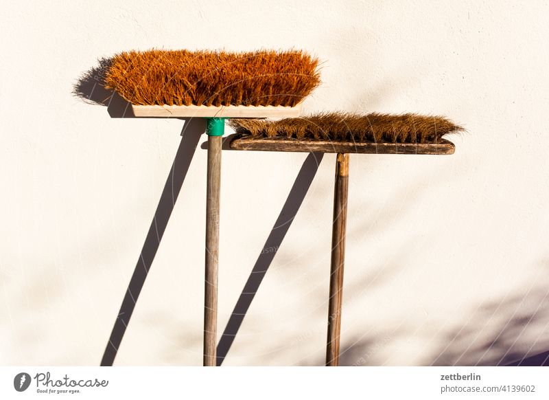 Two brooms again Old age Ajar Lean Broom betziehung Bristles Parents Development Generation Contrast lean Light New Couple Break rest Shadow Stand house broom