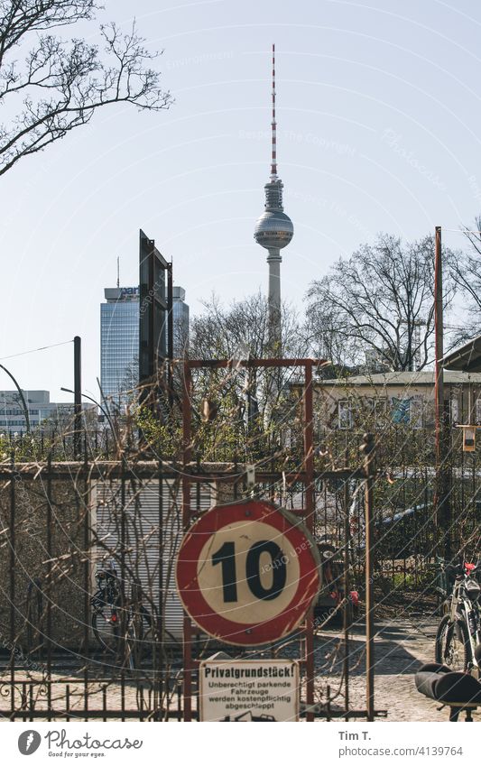 an old traffic sign behind which the Berlin television tower can be seen Road sign 10 Television tower Prenzlauer Berg Town Capital city Downtown Exterior shot