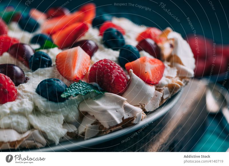 Delicious Pavlova cake with fresh berries pavlova dessert berry meringue sweet food delectable delicious yummy assorted mix strawberry raspberry cherry