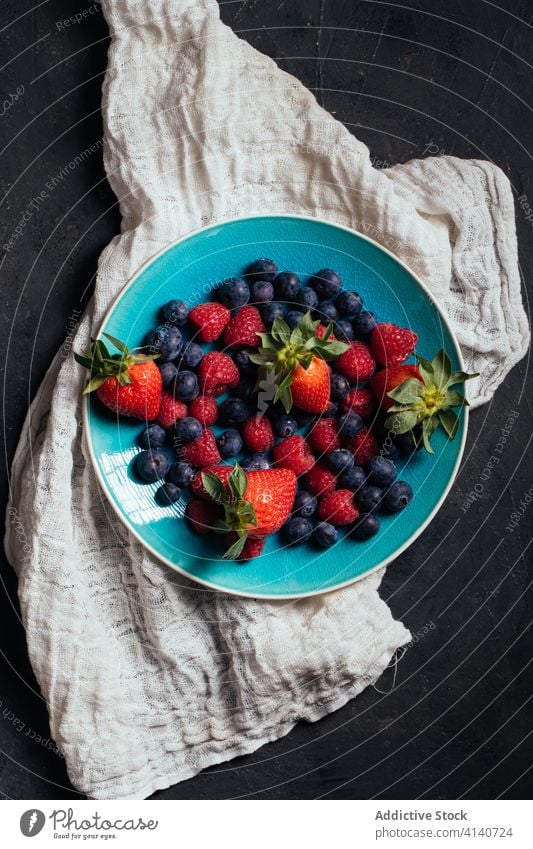 Bowl with fresh assorted berries berry bowl strawberry raspberry blueberry ripe mix food natural delicious various sweet organic healthy dessert vitamin