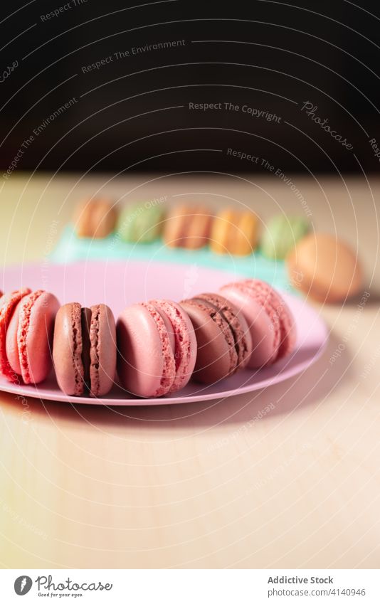 Set of macaroons in shape of smile on plate concept emoji cookie macaron colorful delicious french macaroon tasty sweet dessert biscuit food pastry fresh