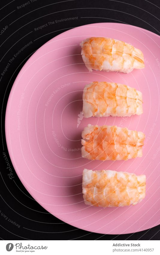 Tasty sushi with shrimps in shape of ice cream set concept tasty ebi nigiri pink plate studio asian food popsicle vibrant vivid bright colorful palatable