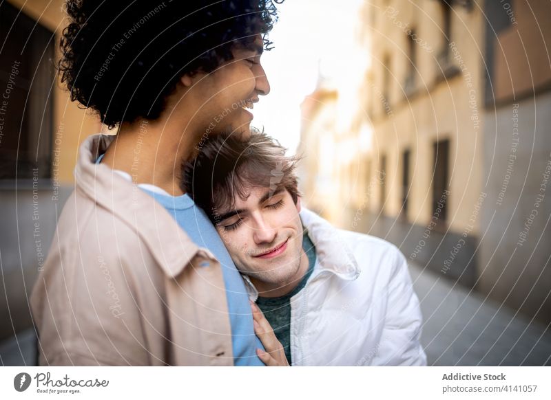 Tender homosexual couple hugging on street gay together lgbt relationship tender embrace multiracial diverse ethnic city love smile happy boyfriend romantic