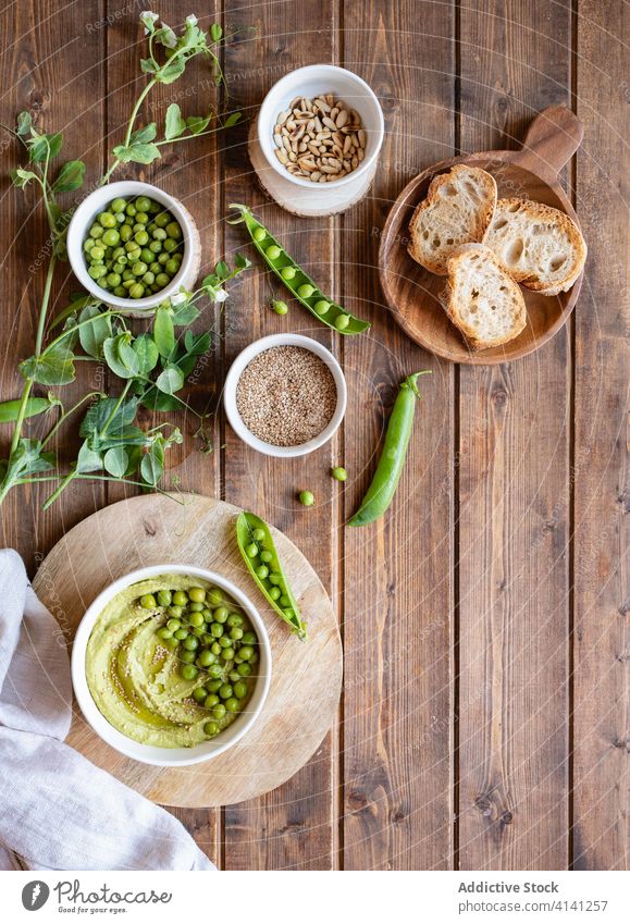 Hummus with green pea and bread hummus food natural tasty appetizer starter serve ingredient cook fresh nutrition healthy delicious cuisine meal homemade