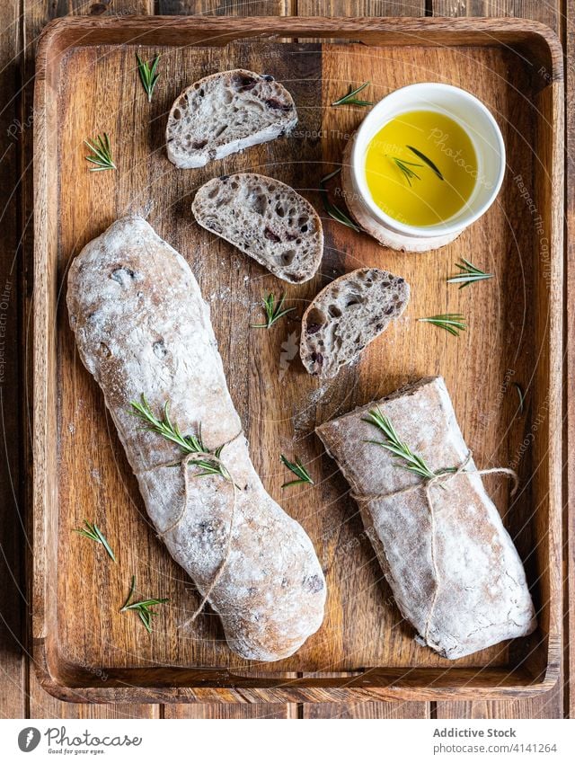 Fresh bread with olive oil and herbs ciabatta italian rosemary fresh tradition food rustic delicious wooden cuisine meal nutrition tasty serve homemade loaf
