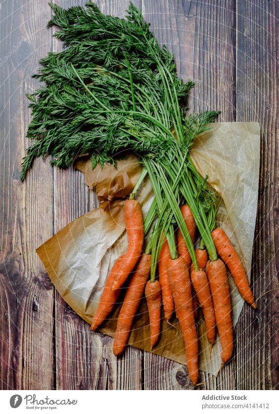 Fresh carrots on wooden table vegetable color various assorted fresh natural healthy food orange vitamin ripe raw nutrition rustic colorful mix plant kitchen