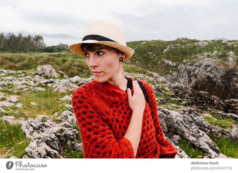 Woman in stylish clothes walking on rural road woman travel nature style trendy path countryside spain asturias llanes female field adventure wanderlust way