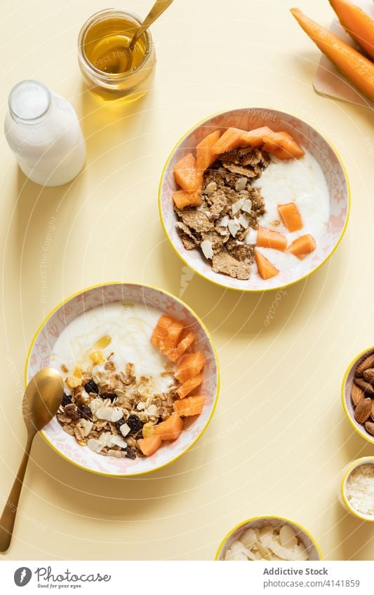 Healthy breakfast bowls with granola and fruits healthy food yogurt melon cantaloupe natural fresh morning delicious nutrition meal organic diet tasty serve