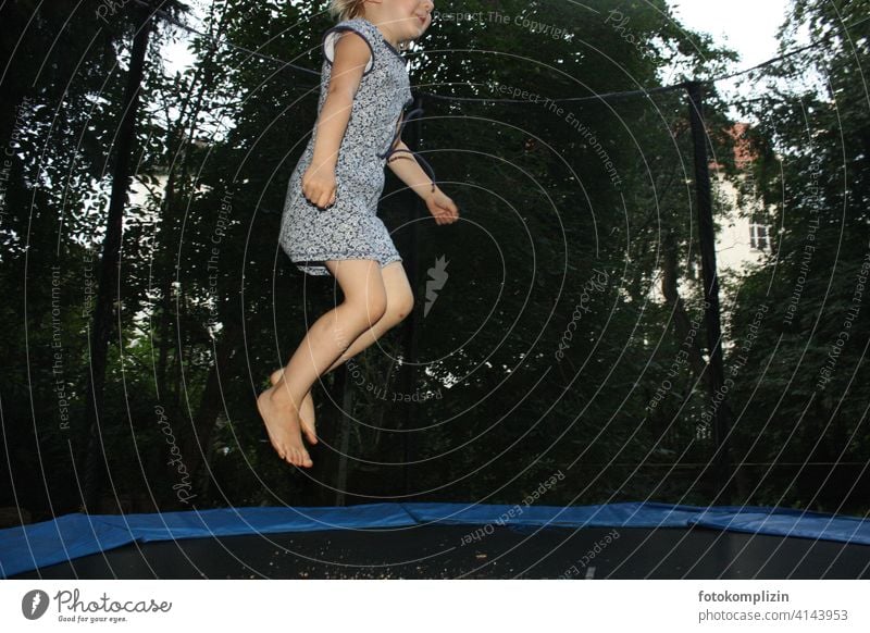 jumping child on trampoline Child Girl Jump Trampoline Hop Movement Joie de vivre (Vitality) Joy Infancy Garden fun Happiness Playing Summer Leisure and hobbies