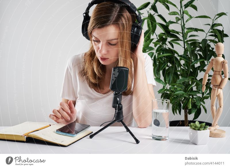 Woman in headphones listen audio cource. podcast education learning online microphone online education broadcasting studio radio blogger media music equipment