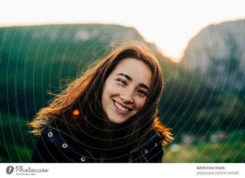 Smiling woman in mountains during sunset traveler highland carefree holiday enjoy relax summer female transylvania romania saint george happy tourism adventure