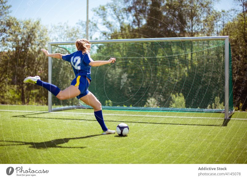 Anonymous Sportswoman Kicking Ball Into Goal A Royalty Free Stock Photo From Photocase