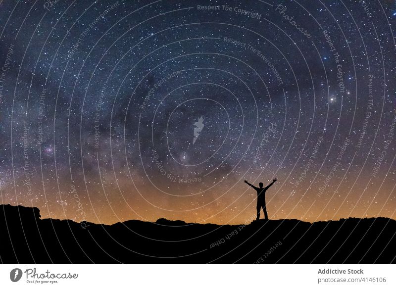Silhouette of a man with the Milky Way in the background starry milky way sky silhouette universe cosmic dark victory cosmos galaxy astronomy journey tranquil