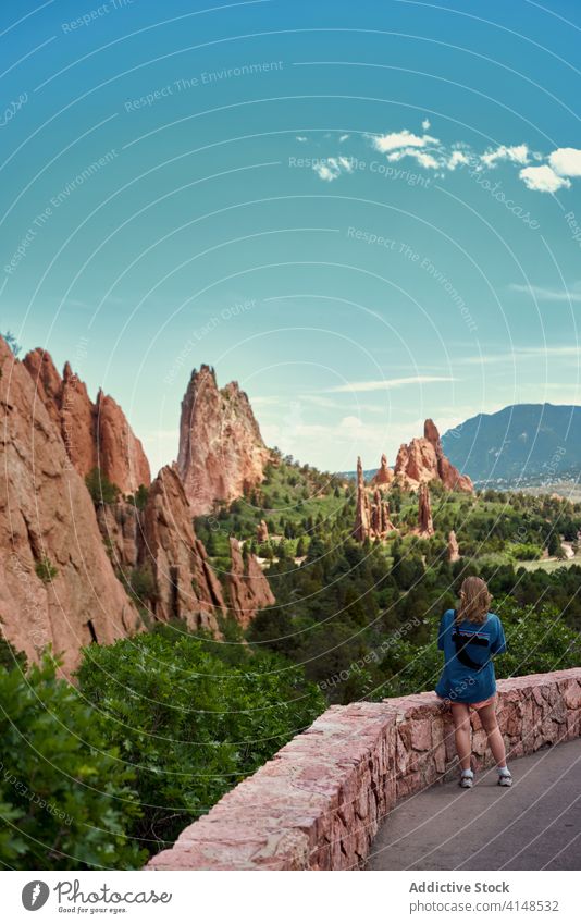 Traveling woman in Garden of the Gods during vacation garden of the gods travel summer landmark viewpoint tourist admire famous female colorado usa
