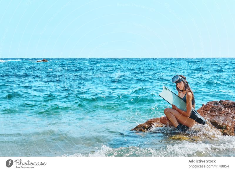 Woman in bikini and goggles in sea diver woman flipper wave water ocean sunlight summer female nature relax stand summertime tropical swimwear paradise idyllic