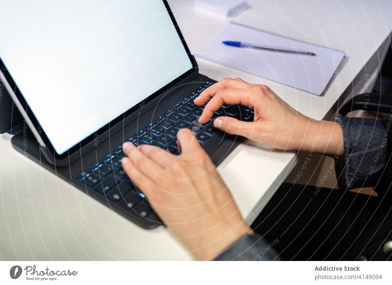 Anonymous busy person using laptop at workplace hand gadget device typing keyboard job online professional freelance modern occupation entrepreneur surfing