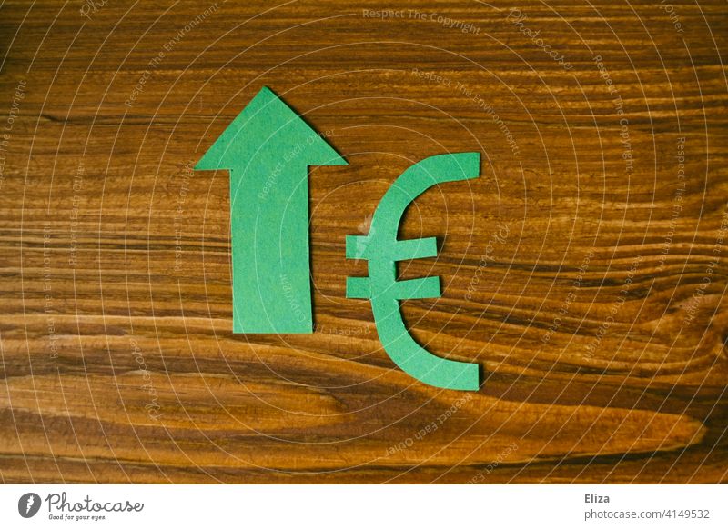 Green euro sign with green arrow pointing up. Investment, return, finance. Euro Money Euro symbol Arrow Upswing yield profit Financial Industry cash flow