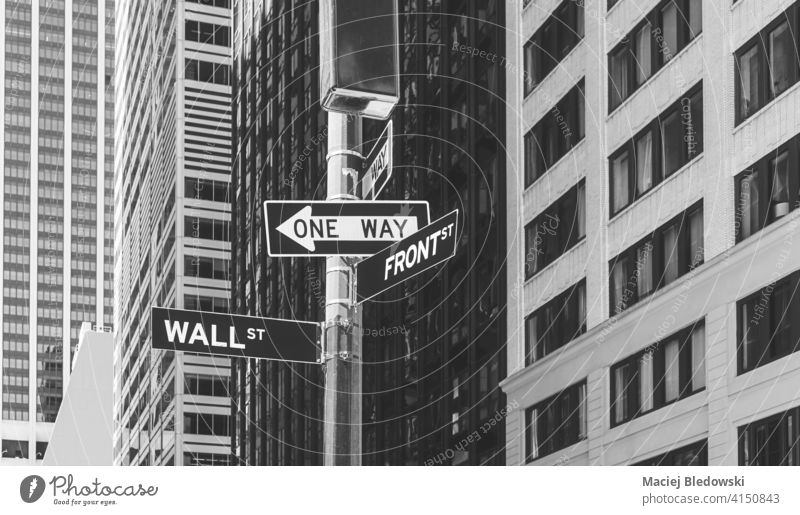 Wall Street, Front Street and One Way signs, selective focus, New York City, USA. city Manhattan street BW york wall new economy financial business America NYC