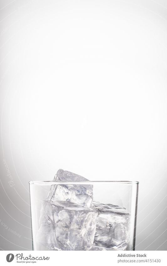 Glass of water in studio glass ice cube refreshment crystal pure cool drink cold transparent liquid beverage clear natural frozen aqua thirst glassware tasty