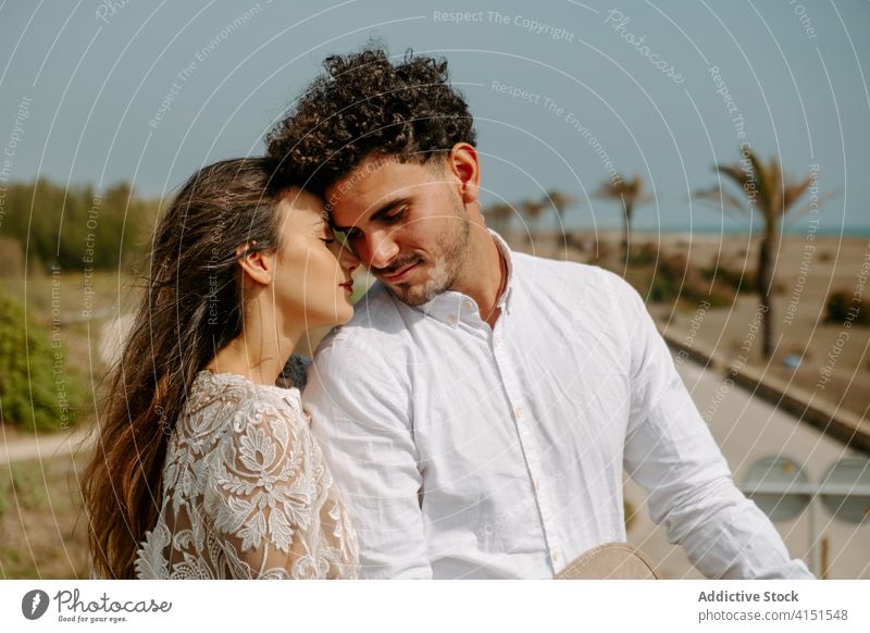 Romantic couple enjoying summer day at seaside romantic admire together relationship newlywed style love young boho bridge bride groom relax happy holiday