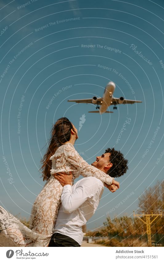 Newlywed couple enjoying romantic journey newlywed travel airplane relationship love honeymoon fly happy cheerful amorous fondness together married amour young