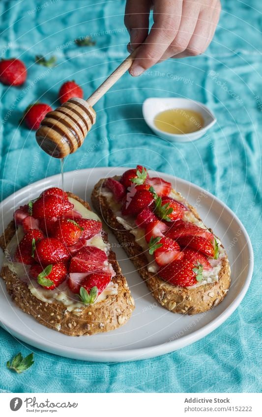 Delectable sweet toasts with strawberry bread fresh breakfast honey yummy food dessert snack meal plate delicious tasty serve homemade morning organic dish