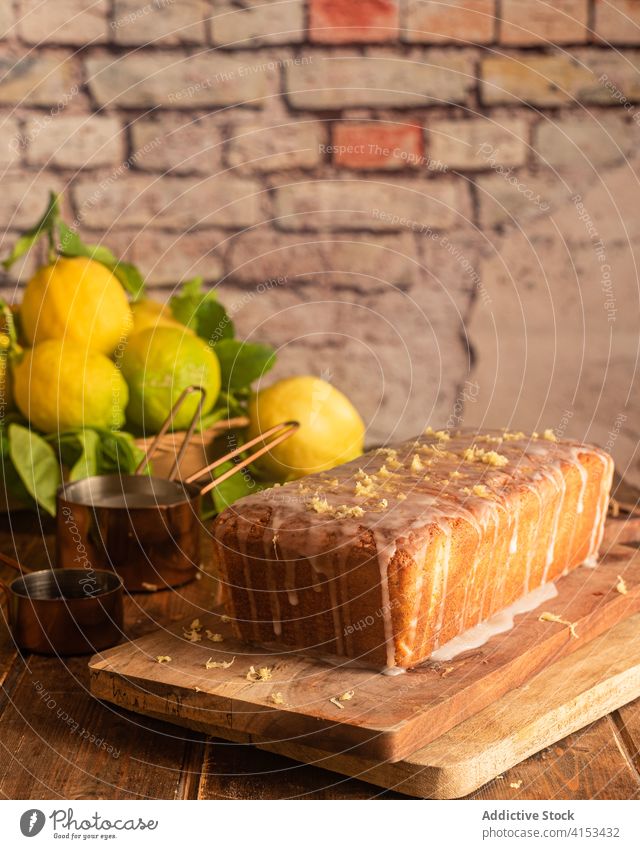 Homemade lemon cake covered with glaze poppy baked pastry sweet dessert icing food homemade cook fresh rustic appetizing cuisine yummy kitchen dish confection