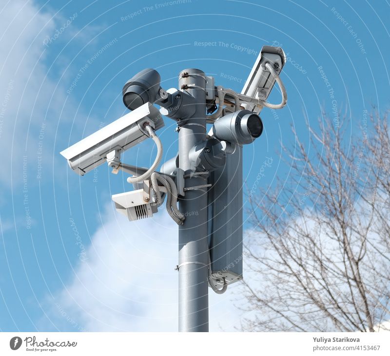 Real time Modern Online Security CCTV cameras surveillance system. An outdoor video surveillance cameras is installed on a metal post. Equipment system service for safety life or asset.
