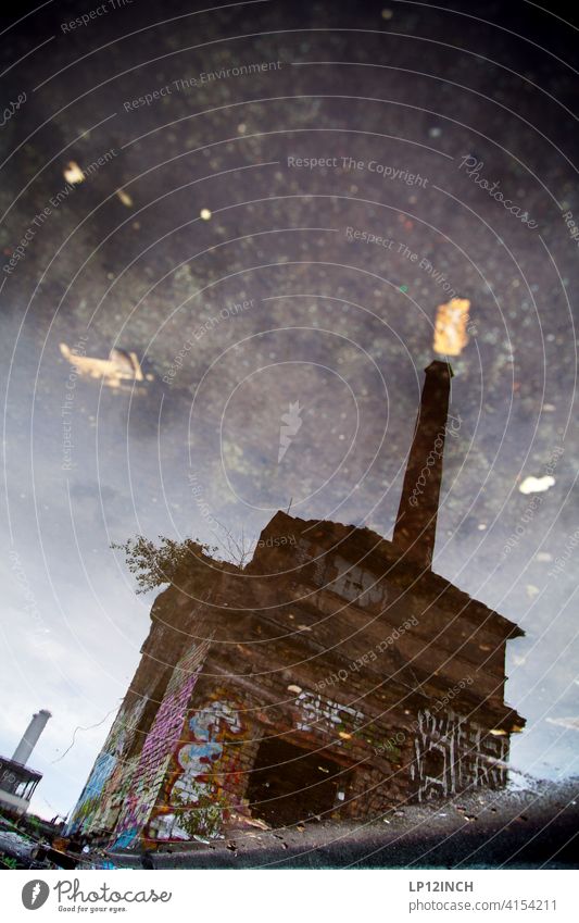 Factory in the puddle puddle mirroring Chimney Puddle reflection graffiti Floor covering Water forsake sb./sth. somber frightening Surrealism Berlin surreal