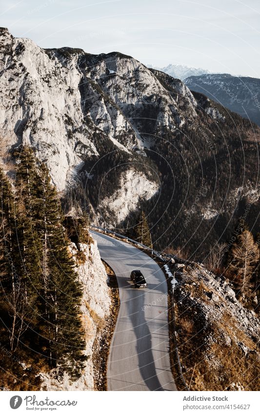 Winding road through forested mountains wind curve slope car roadway coniferous wild nature danger travel route environment journey trip woods tourism germany