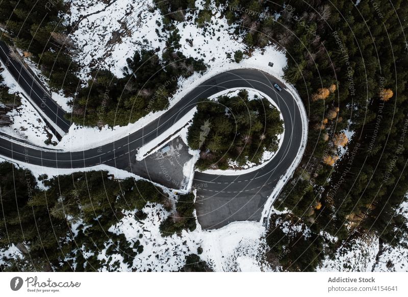 Road junction in forest in winter road car drive snow coniferous season woods austria germany lonely landscape frost scenic travel scenery evergreen tree white