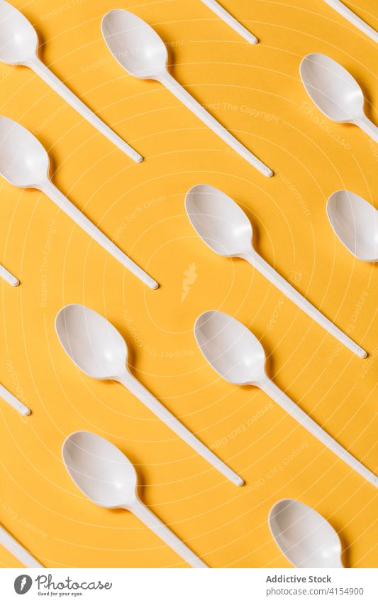 Set of disposable plastic forks on yellow background spoon takeaway cutlery tableware utensil set dishware tool restaurant kitchenware to go accessory object