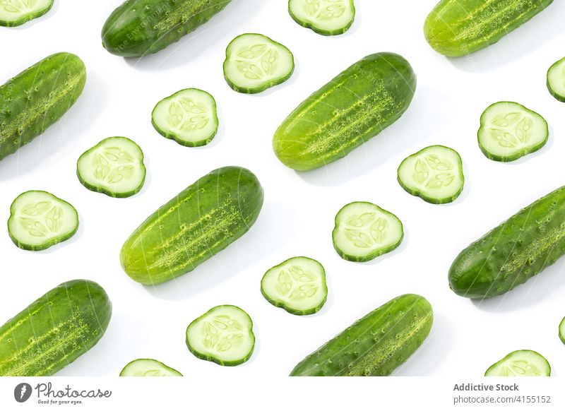 Cucumber pattern isolated on white background. Cucumis sativus cucumber halved vegetable food slice healthy green cut ripe raw ingredient organic freshness