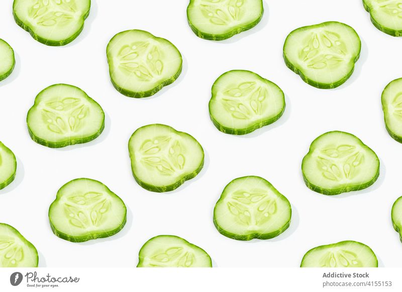 Cucumber slice pattern isolated on white background. Cucumis sativus backdrop cucumber slices vegetable food healthy green cut ripe raw ingredient organic