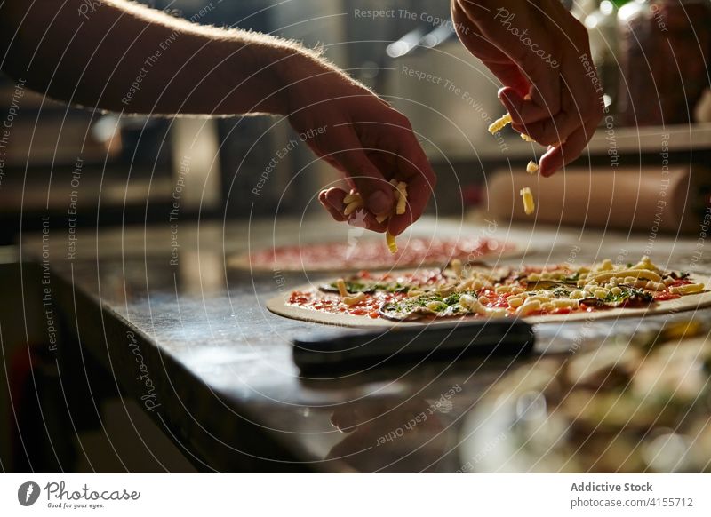 Preparing vegetarian pizza in restaurant kitchen prepare process cook dough vegetable food ingredient cuisine italian tradition roll sauce culinary meal