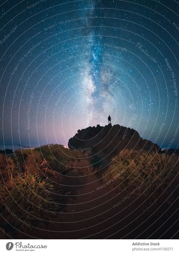 Anonymous man standing on hill in highlands travel mountain milky way admire starry enjoy traveler journey tourism vacation trip scenery nature landscape male