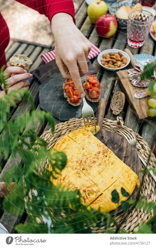 Crop woman eating delicious pie picnic table piece fork tasty homemade nature female valle del jerte caceres spain dish pastry fresh food cuisine recipe meal