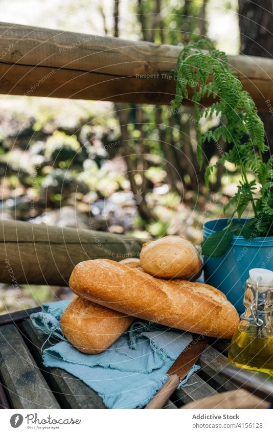 Fresh bread on table in forest picnic loaf baked woods delicious fresh nature valle del jerte caceres spain food wooden tasty tradition natural gourmet