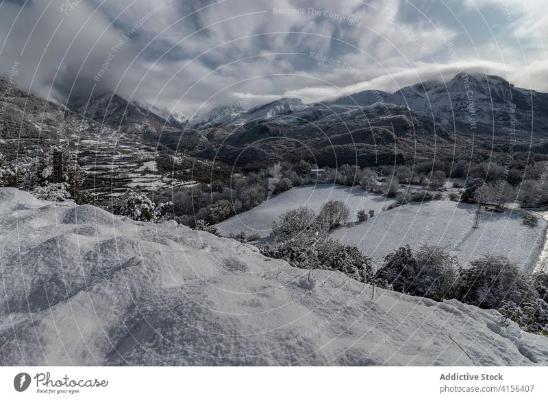 Snowy mountain ridge in winter range snow cloudy sky fog dramatic highland landscape amazing pyrenees huesca spain scenery spectacular cold nature environment