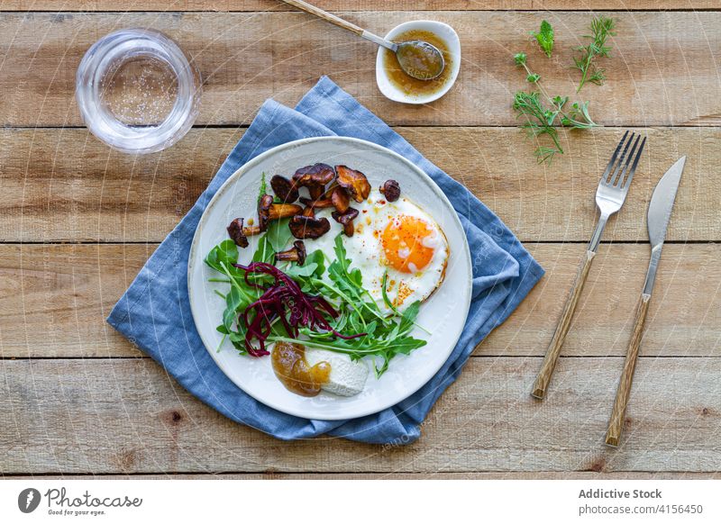 Delicious dish with fried eggs and mushrooms salad plate portion serve food cuisine palatable fresh meal delicious dinner healthy appetizing nutrition yummy