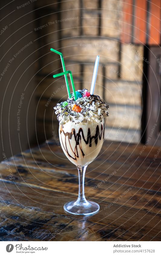 Yummy milkshake with whipped cream and chocolate dessert sweet glass yummy food sprinkle serve delicious colorful tasty drink confectionery appetizing snack