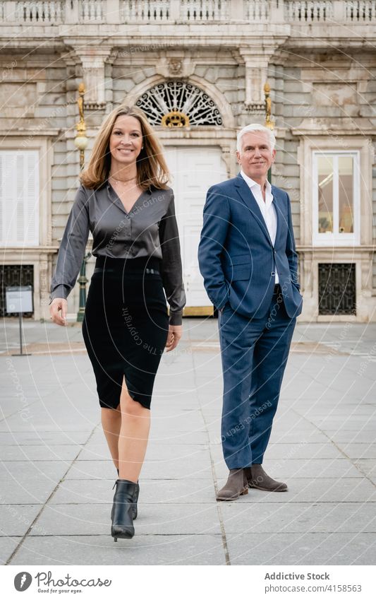 Elegant couple in classy wear on city street businesspeople elegant style fashion confident success outfit rich well dressed luxury middle age mature urban aged