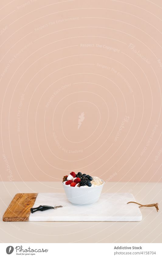 Tasty breakfast bowl on table in kitchen nutrition berry healthy food morning serve muesli vitamin fresh delicious sweet treat natural meal towel various tasty