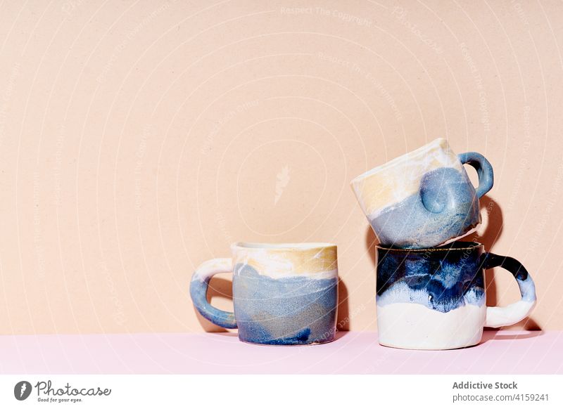 Handmade ceramic cups at studio clay handmade minimal still life composition kitchen utensil pastel design crockery object tea container porcelain mug espresso