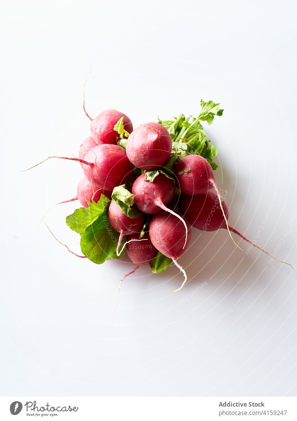 Fresh radishes diet nature vegan closeup produce farming sweet tuber white fresh red vegetable salad green root sliced leaf spring plant garden food small raw
