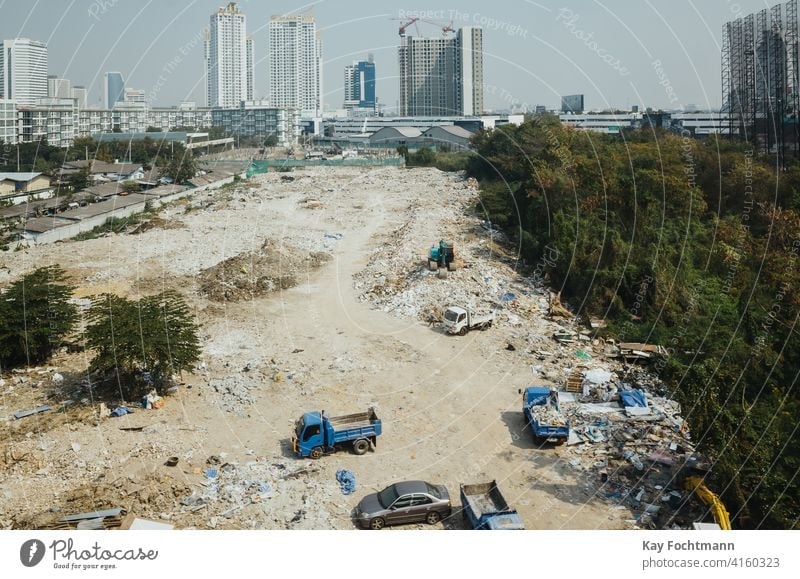 building site in southeast asia aerial architecture automotive boom business city cityscape commerce community construction day development dirt downtown
