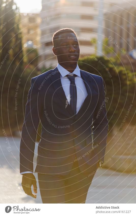 Black businessman in formal suit standing in city confident urban modern elegant executive success manager professional adult male entrepreneur african american
