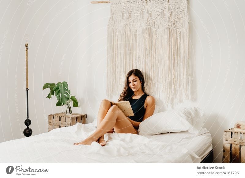Woman reading book in bedroom woman home morning relax rest comfort chill cozy positive inspiration young female smile literature hobby pleasure leisure weekend
