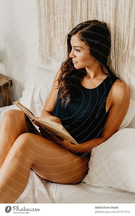 Woman reading book in bedroom woman home morning relax rest comfort chill cozy positive inspiration young female smile literature hobby pleasure leisure weekend